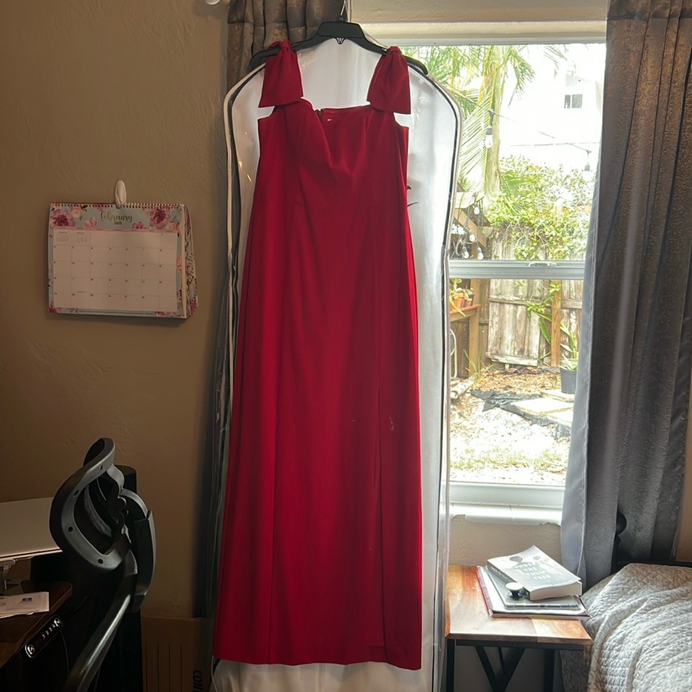 Beautiful red floor length gown. Off the shoulder bow details. Size 14